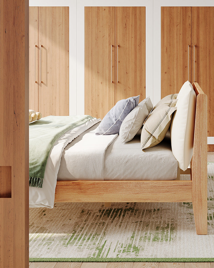 Bright Minimalist bedroom fearturing a green meadow washable rug, complemented by a wooden bed with cozy light-colour beddings.